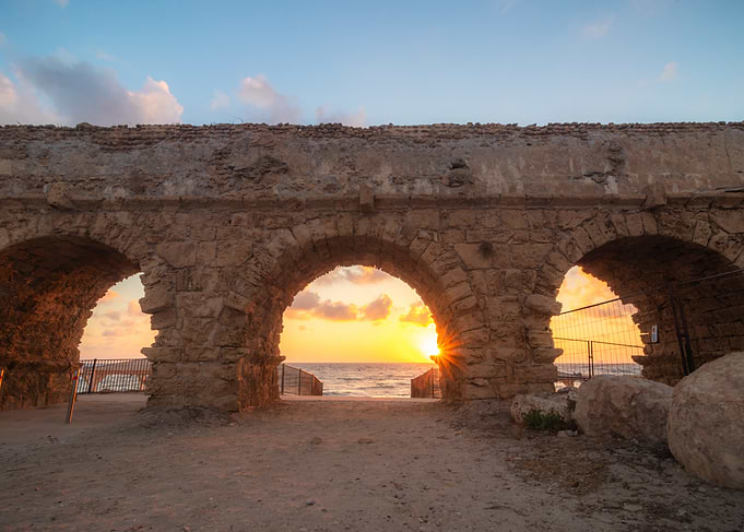 Ancient Aqueduct Arches at Sunset