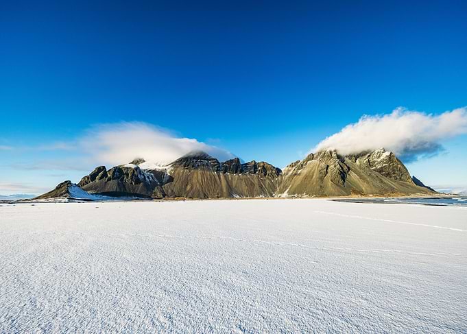 Snowy Mountains Under Blue Sky