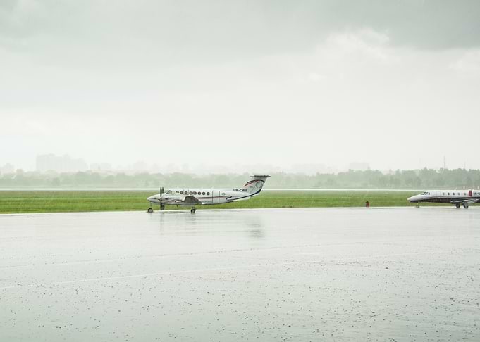 Airplanes on a Rainy Tarmac