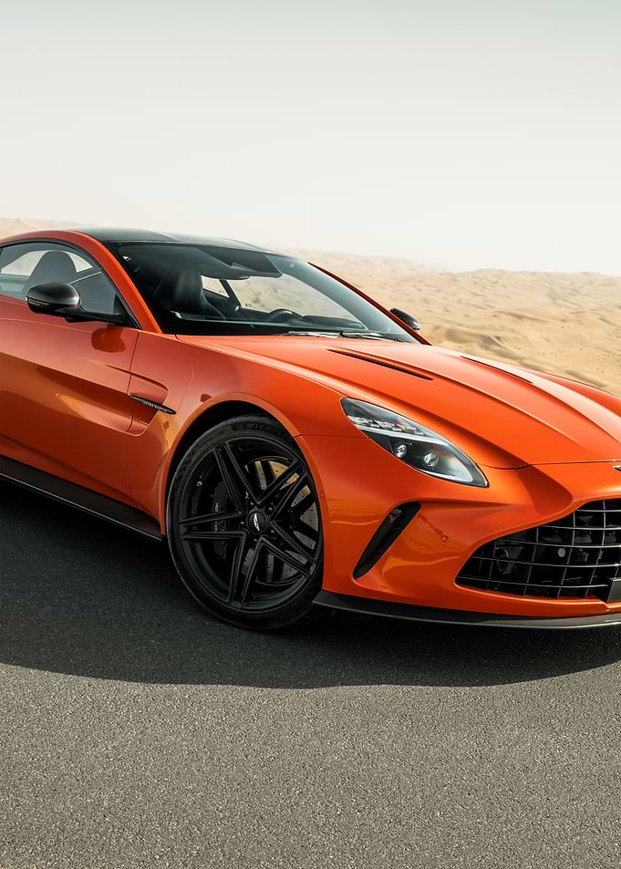 Orange Aston Martin in Desert Landscape