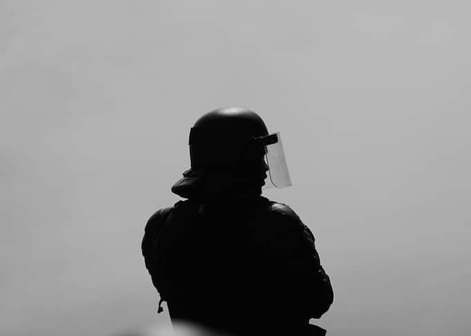 Silhouette of a riot police officer