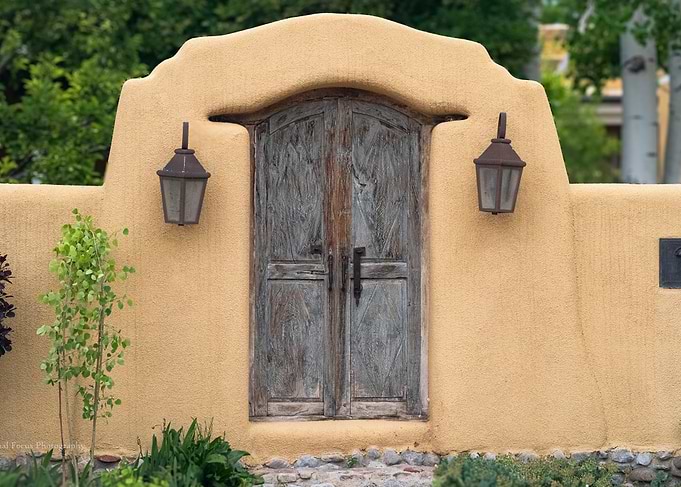 Rustic Adobe Wall with Weathered Wooden Door