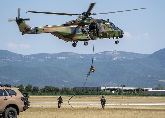 Military Helicopter Rappelling Soldiers