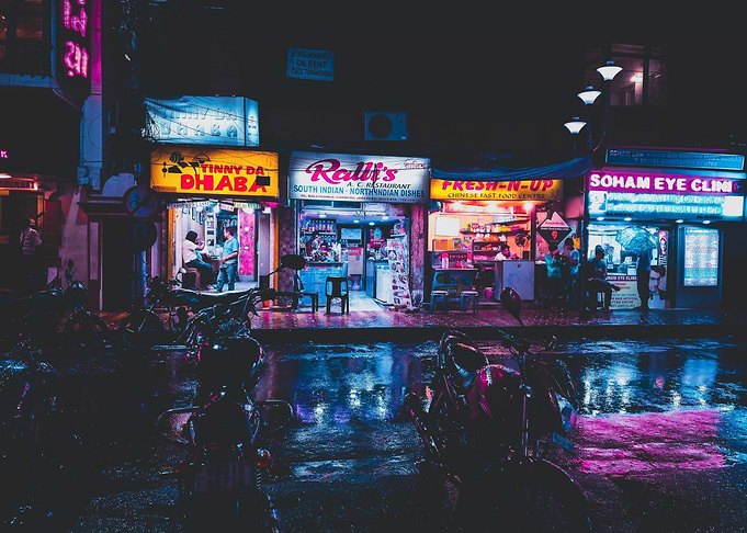 Neon-lit street scene at night
