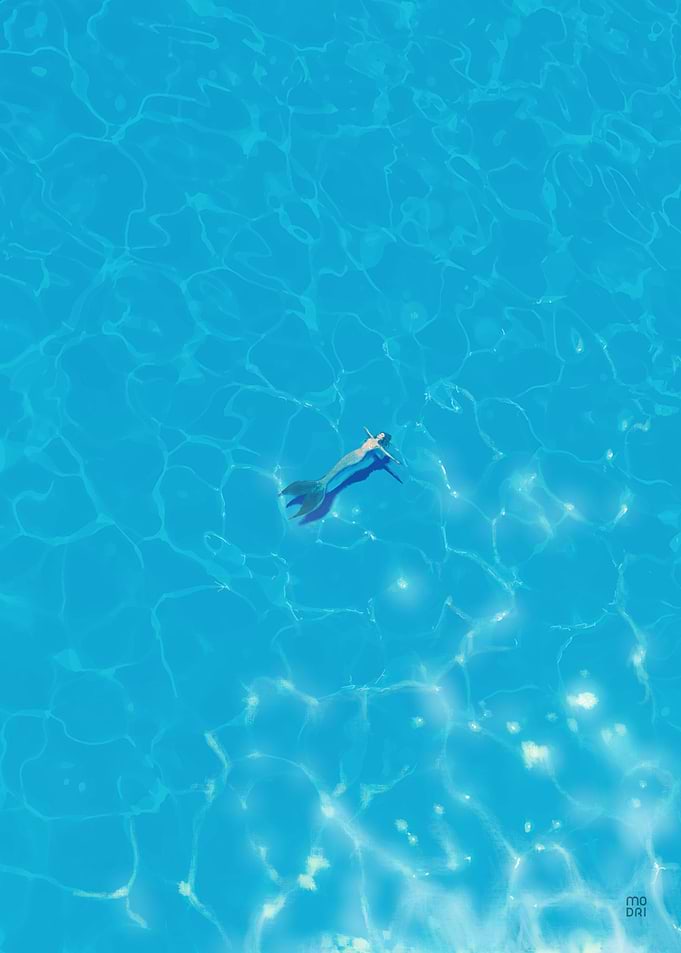 Mermaid Floating in Clear Blue Water