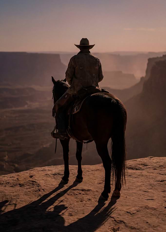 Lone Cowboy Overlooking Canyon