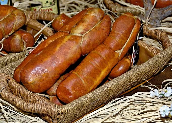 Artisan Smoked Sausages in Wicker Basket