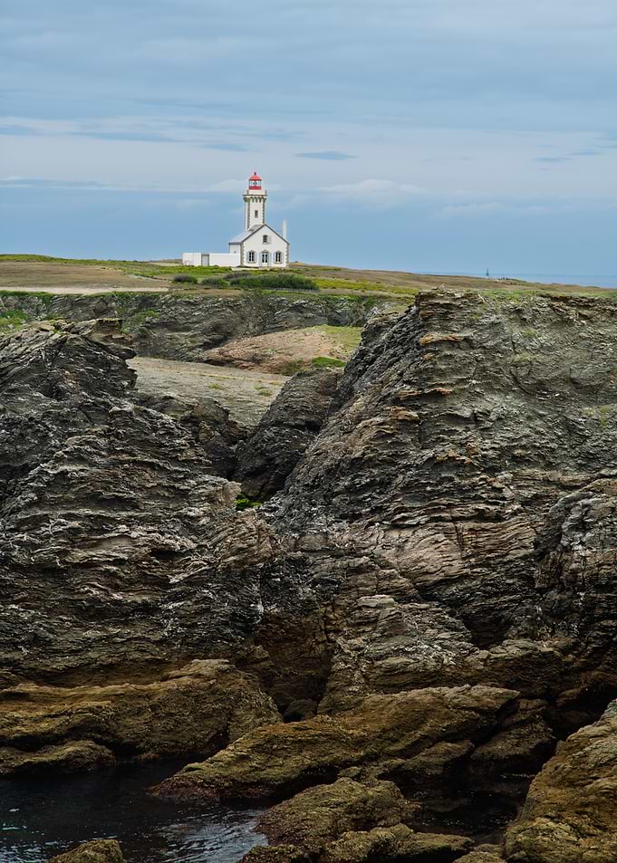 Lighthouse Pointe des Poulains on a Rocky Coast