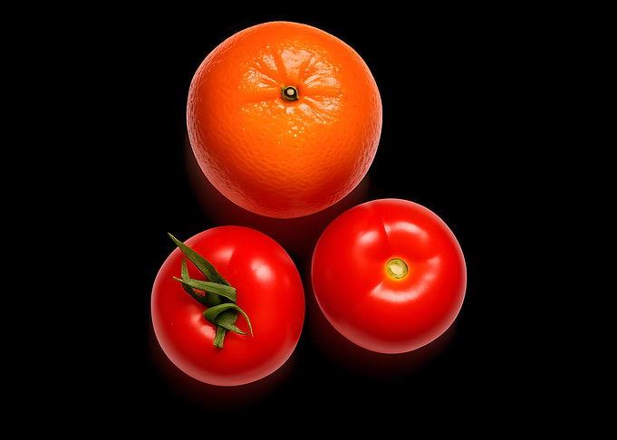 Fresh Orange and Two Tomatoes