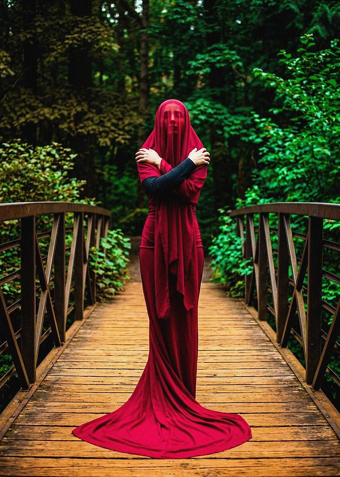 Woman in Red Veil on Bridge