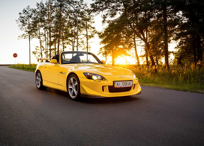 yellow Honda S2000 at sunset