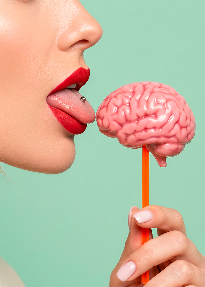 Woman Licking a Brain Lollipop