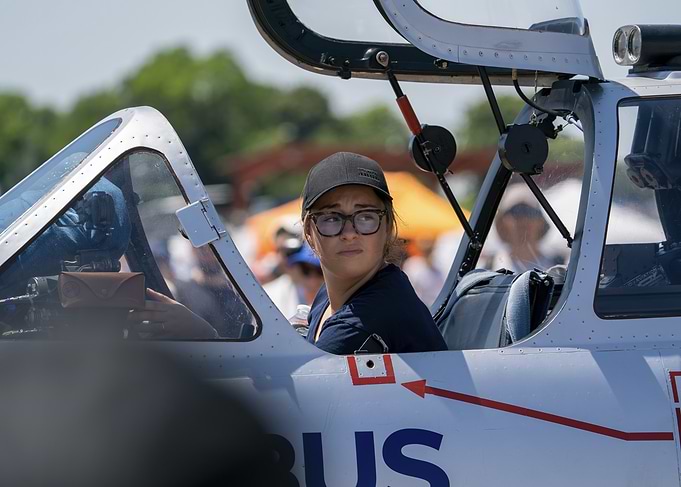 Woman sitting in airplane cockpit fouga magister