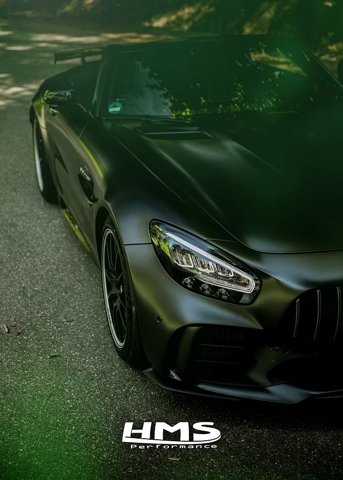 Matte Black Car on Forest Road