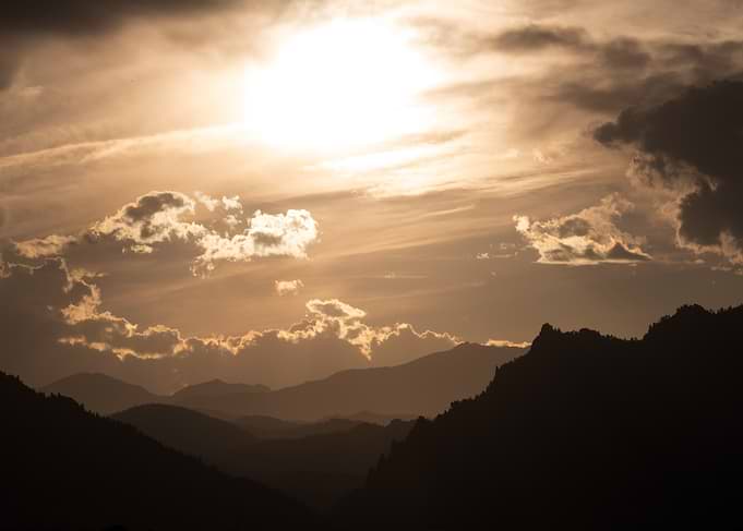 Golden Sunset Over Mountain Silhouettes