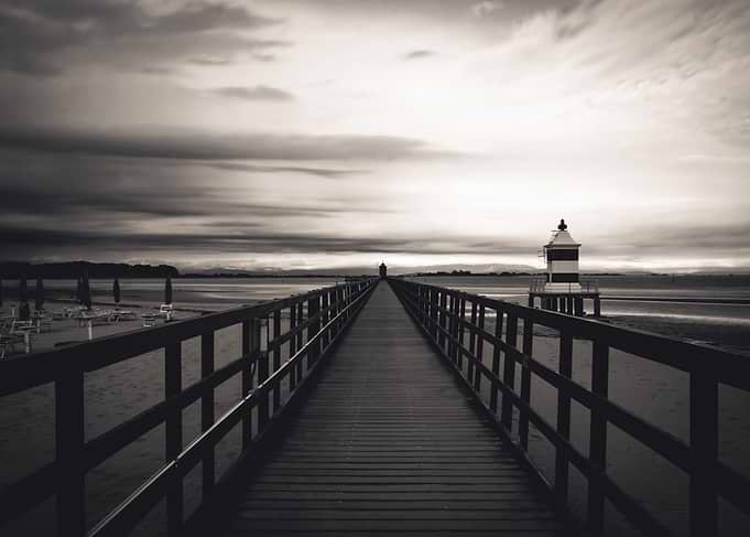 Wooden Pier Leading to Lighthouse
