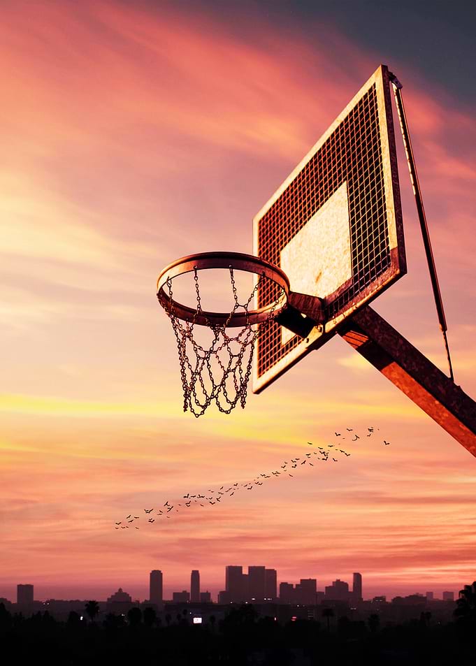 Basketball Hoop at Sunset Skyline
