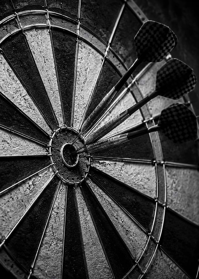 Three Darts Hitting Bullseye