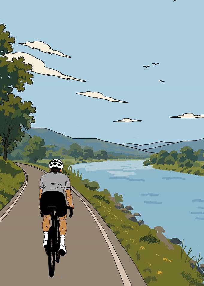 Cyclist Riding Along a River