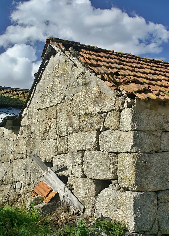 Rustic Stone Barn Under Blue Sky