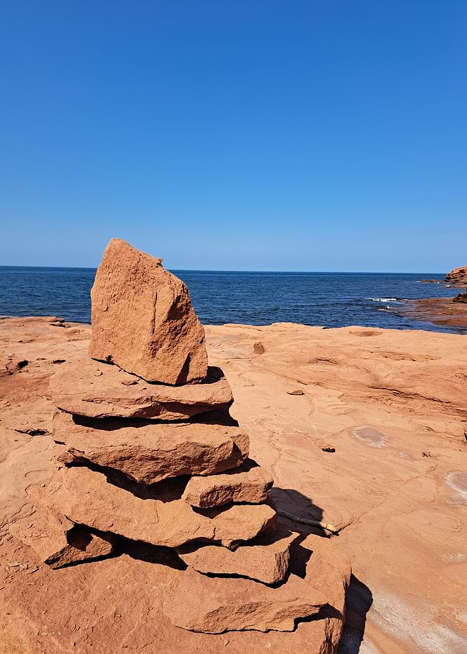 Stone Cairn on Red Sandstone Coast