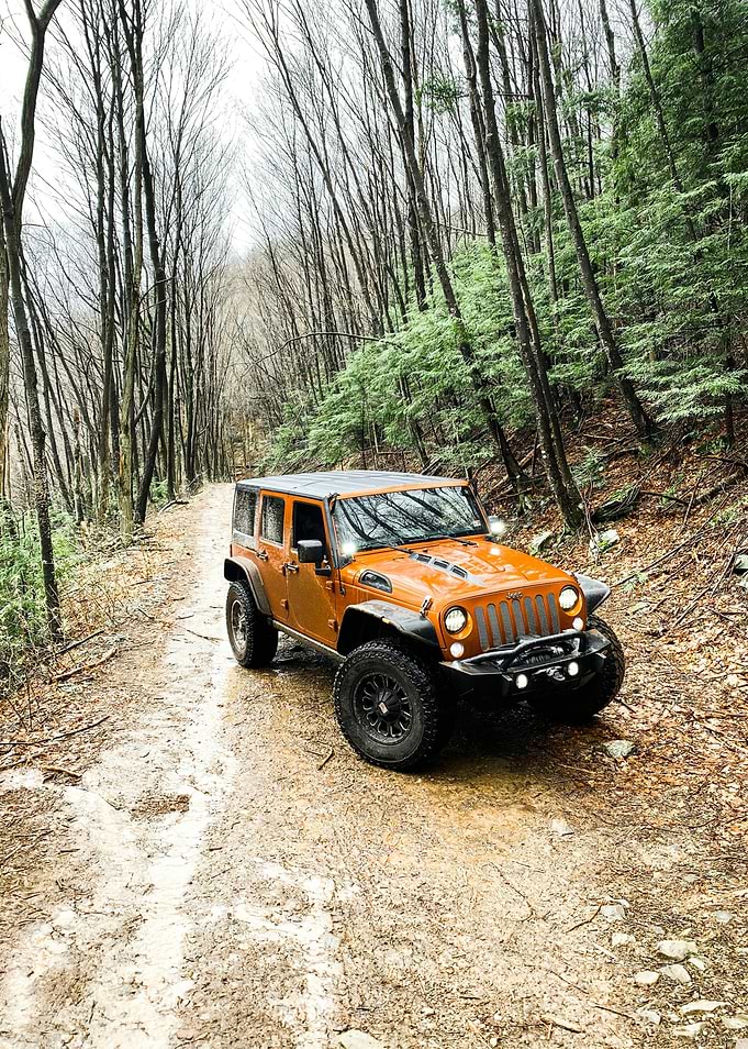 Orange Jeep Wrangler Off-Roading