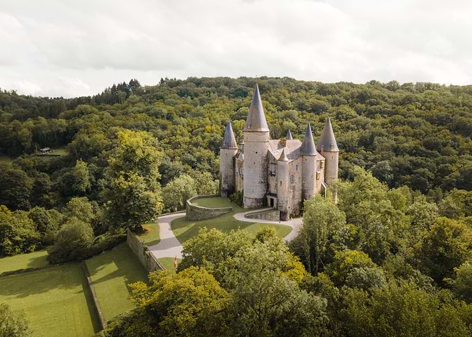 Vêves Castle Surrounded by Forest
