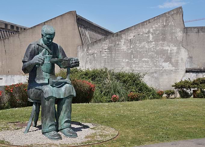 Bronze Cobbler Statue in Park