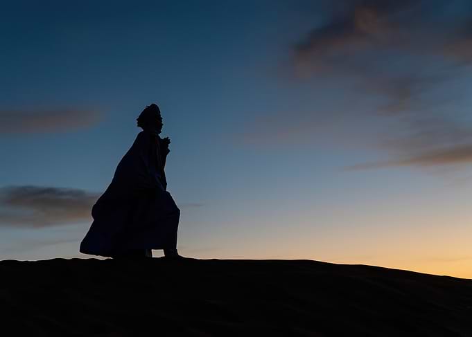 Silhouette of a Person in Desert
