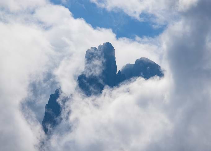 Jagged Mountain Peak Amidst Clouds