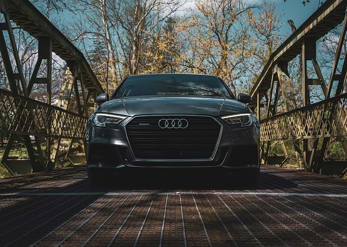 Dark Grey Audi on Metal Bridge