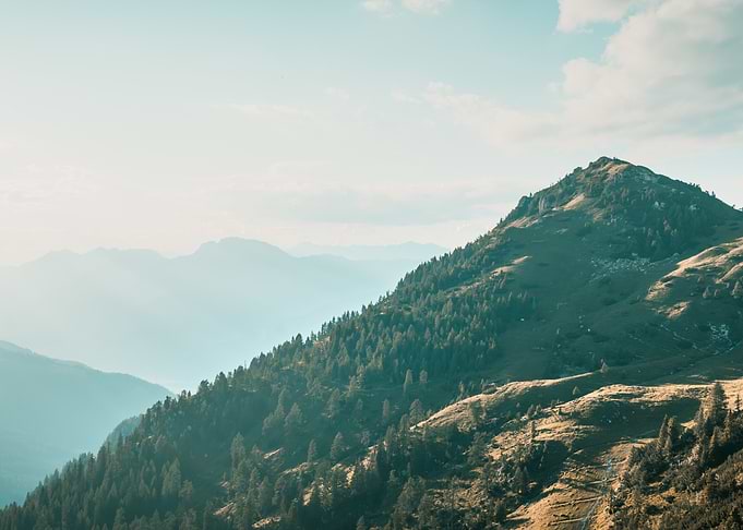 Sunlit Mountain Slope in the Alps