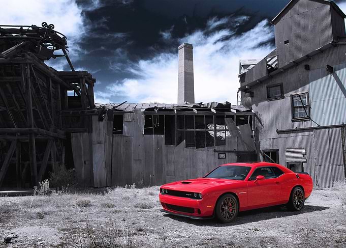Red Dodge Challenger at Abandoned Mill