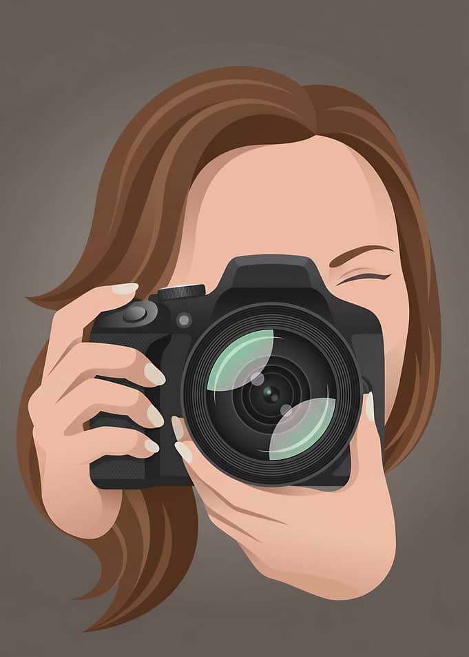 Woman Holding a DSLR Camera