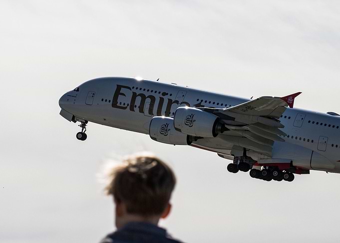 Child Watching Emirates A380 Takeoff