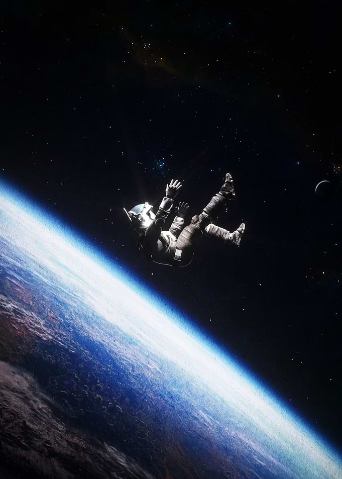 Astronaut Floating Above Earth