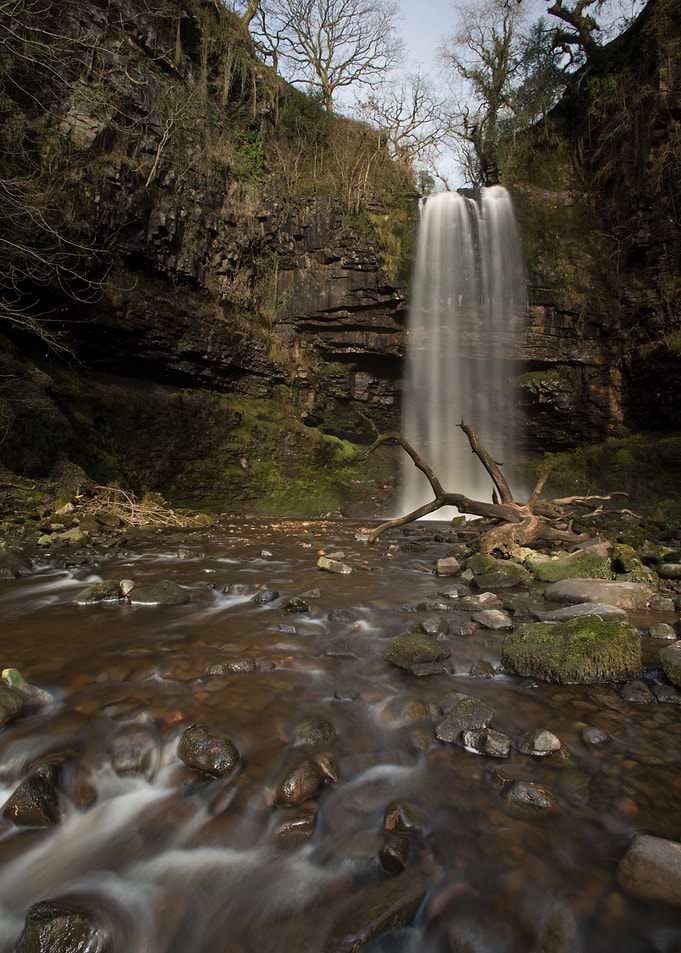 Waterfall in a Rocky Forest Setting