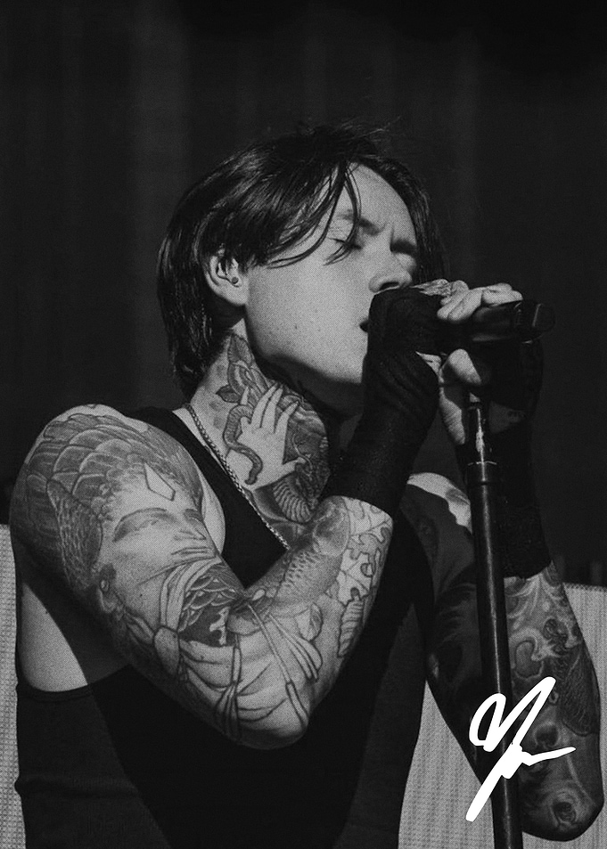 Tattooed Male Singer Performing Live