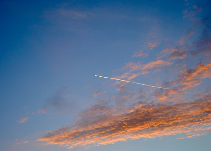 Airplane Contrail in Sunset Sky