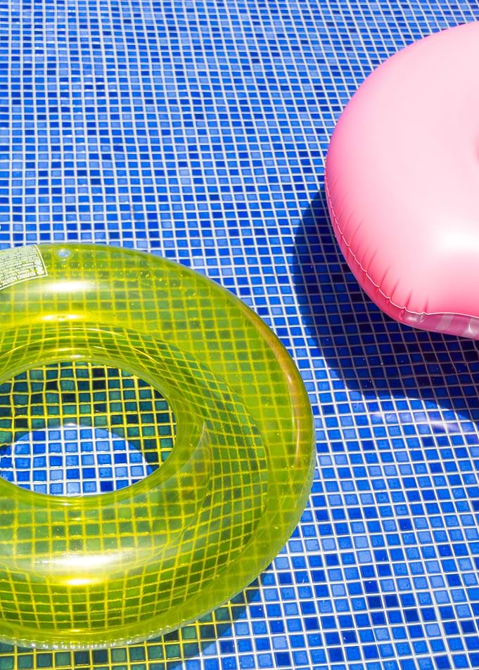 Colorful Pool Floats in Blue Pool