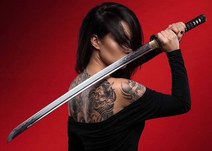 Woman with Katana and Back Tattoo