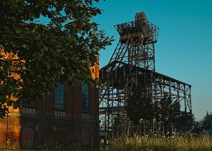 Historic Industrial Mine Headframe at Sunrise