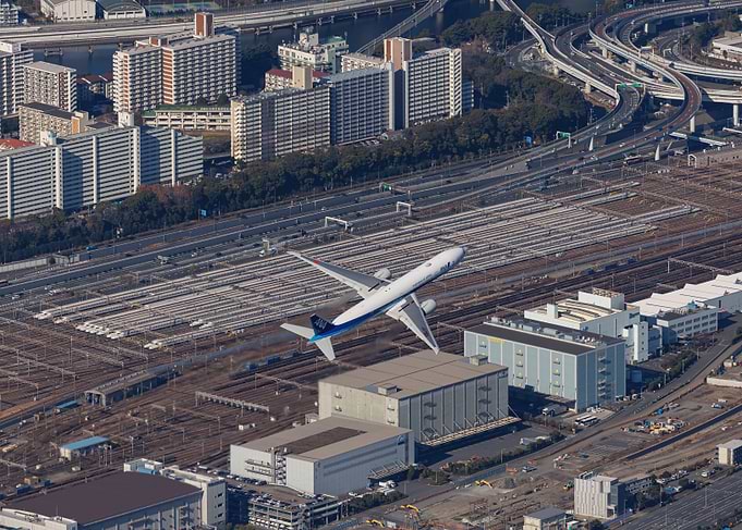 Boeing 777 Flying Over Shinkansen Depot in Tokyo