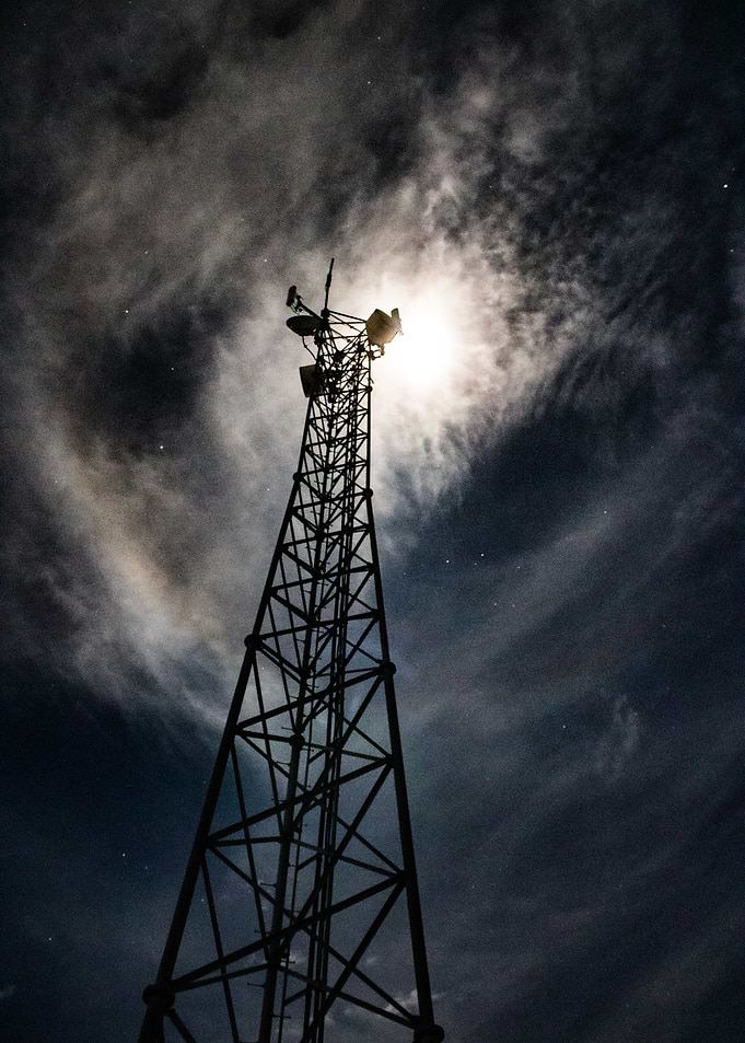 Communication Tower Under Moonlight