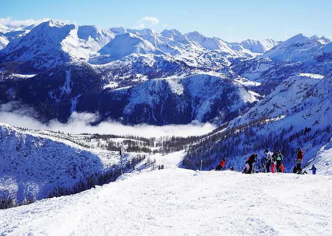 Skiers on a Sunny Mountain Slope