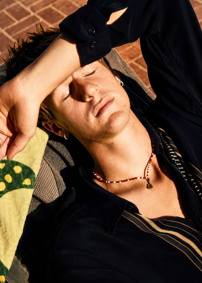 Young man relaxing in sunlight