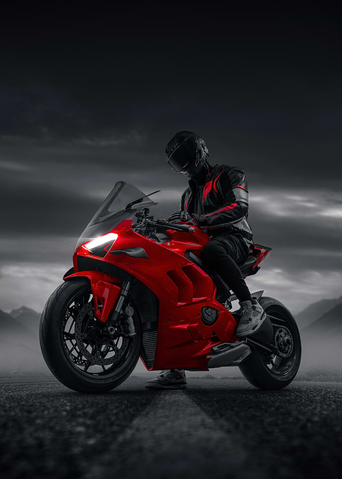 Red Sportbike Rider in Moody Landscape