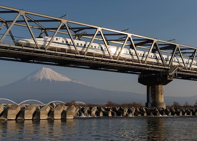 Shinkansen Crossing the Bridge with Mount Fuji at Sunrise