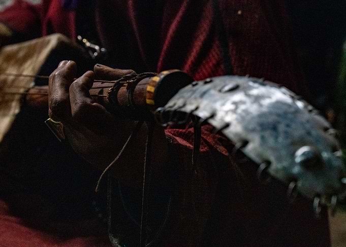 Traditional Musician Playing Stringed Instrument