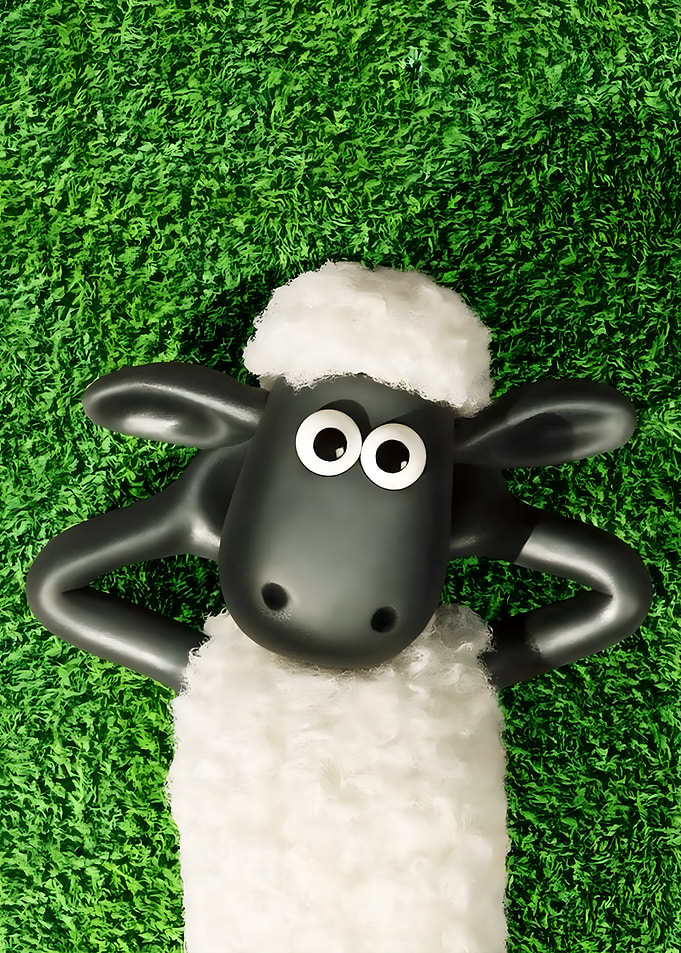 Shaun the Sheep Relaxing on Grass